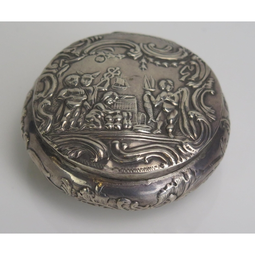 571 - A continental silver circular snuff box, stamped marks, decorated with a prancing stag, 6cm diameter... 