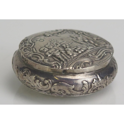 571 - A continental silver circular snuff box, stamped marks, decorated with a prancing stag, 6cm diameter... 