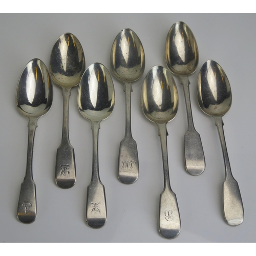 577 - Seven assorted silver Fiddle pattern dessert spoons, various makers and dates, three crested, two in... 