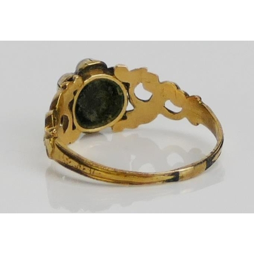 58 - A Victorian Mourning Ring set with a hardstone forget-me-not cameo and in a high carat precious yell... 