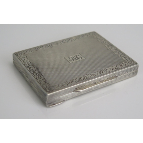 594 - A continental silver card case, stamped marks, initialled, of rectangular outline, with engine turne... 