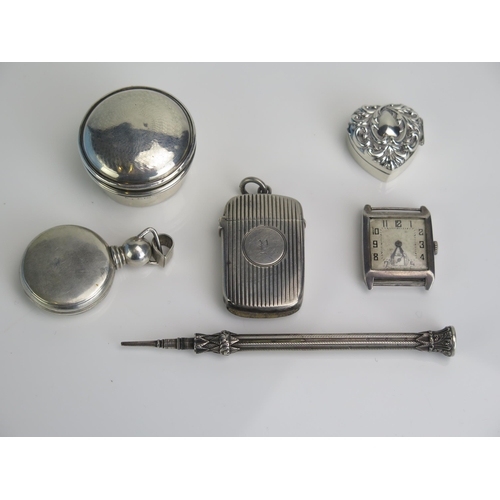 597 - A mixed collection of silver and plated wares including a vesta case by George Unite, heart-shaped b... 