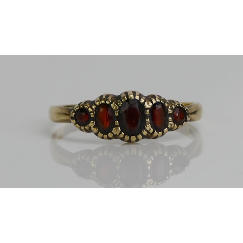 60 - A 9ct Gold and Garnet Five Stone Ring, size Y, hallmarked, 2.45g