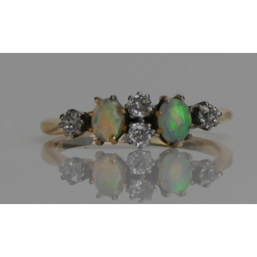 61 - An Antique 18ct Gold, Opal and Old Cut Diamond Six Stone Ring, c. 4.3x3.6mm opals, size M.5, stamped... 