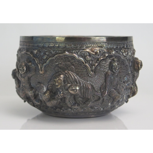 628 - An Indian silver bowl decorated with figures and tigers, 13cm diameter, 227gms, 7.30ozs