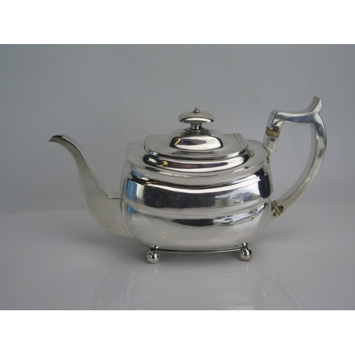 659 - A George  silver teapot, maker William Bennett, London, 1807, of barge-shaped outline, raised on fou... 