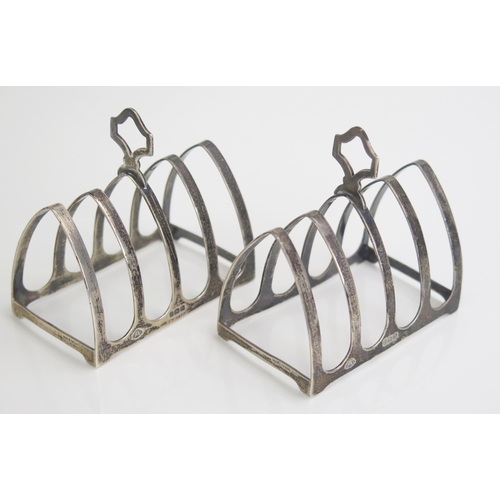 676 - A pair of George VI silver four division toast racks, maker Adie Brothers Ltd, Birmingham, 1937, of ... 