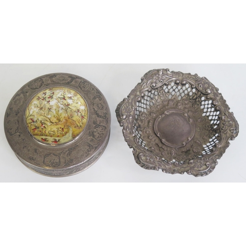 703 - A Persian silver circular box and cover, 10cm diameter together with a silver bon bon dish, 12cm dia... 