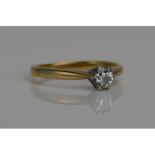 74 - A Brilliant Round Cut Diamond Solitaire Ring in a high carat precious yellow and white metal setting... 