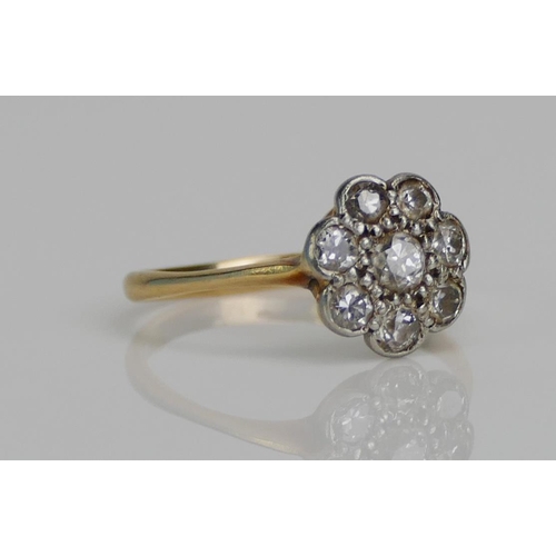 75 - An Old Cut Diamond Flower Head Cluster Ring in a high carat precious white and yellow metal setting,... 