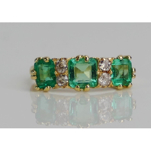 76 - An Antique18ct Gold, Emerald and Diamond Seven Stone Ring, c. 5.3mm principal stone, size N.5, Birmi... 