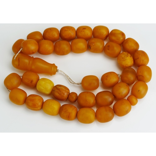 86 - A Large Yellow Amber Rosary Bead, 203.52g