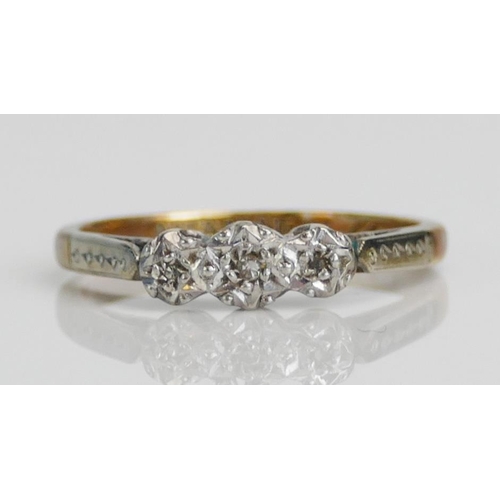 91 - A 9ct Gold and Diamond Three Stone Platinum Illusion Set Ring, size J, stamped 9CT&PLAT, 1.69g