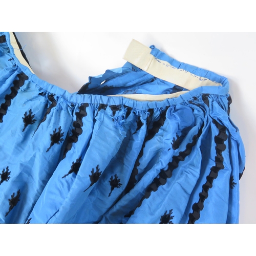 1765A - A late Victorian peacock blue silk skirt with applied black trim, a matching purse, assorted child.s... 