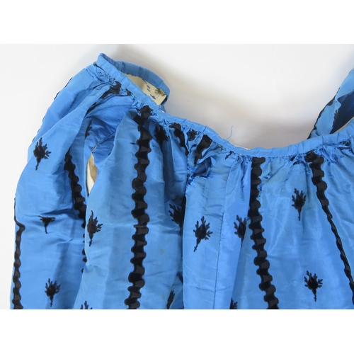 1765A - A late Victorian peacock blue silk skirt with applied black trim, a matching purse, assorted child.s... 