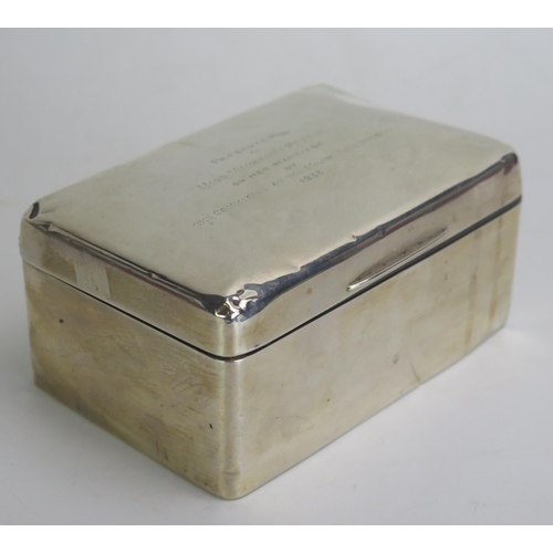 678 - A George V silver cigarette box, maker's mark worn, Birmingham, 1928, inscribed, of rectangular outl... 