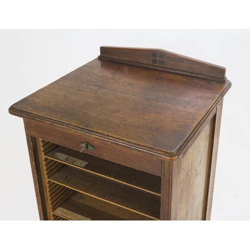 822 - An Oak Tambour Fronted Filing Cabinet, 48(w)x95(h)x45(d)cm