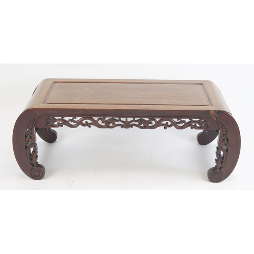 824 - An Early 20th Century Chinese Rosewood Opium Table with carved and pierced decoration, 95(w)x33(h)x4... 