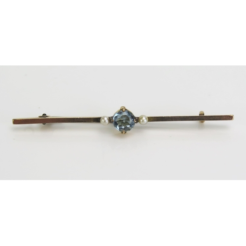 95 - An Aqua Marine and Seed Pearl Bar Brooch in a precious yellow metal setting, 56.4mm long, KEE tests ... 