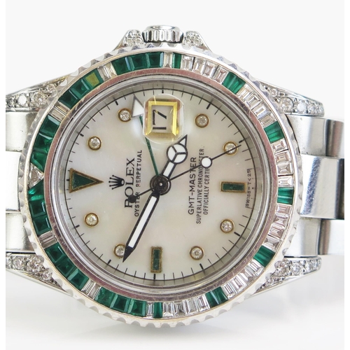 291 - A ROLEX Oyster GMT-MASTER Steel Cased Wristwatch with aftermarket emerald and diamond bezel and to t... 