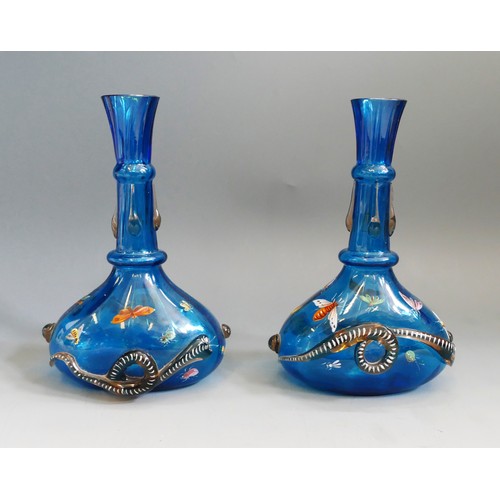 1193 - A pair of possibly Venetian blue glass vases of squat form with slender necks, with applied snake de... 