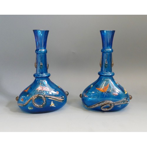 1193 - A pair of possibly Venetian blue glass vases of squat form with slender necks, with applied snake de... 