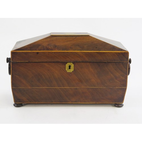 1299A - A 19th century mahogany and boxwood strung tea caddy of sarcophagus outline, the hinged lid enclosin... 