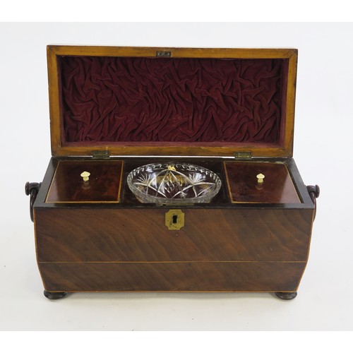 1299A - A 19th century mahogany and boxwood strung tea caddy of sarcophagus outline, the hinged lid enclosin... 