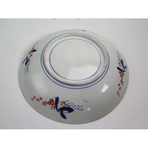 1057 - A Chinese charger, decorated in the Imari palette with birds and flowering shrubs, 41cm diameter.