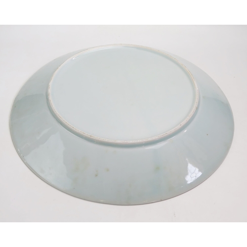 1058 - A large Chinese celadon charger, with crackle glaze decoration, 50cm diameter.