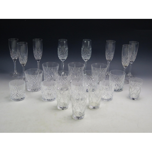 1084 - A set of eight Edinburgh crystal glass wine flutes, six crystal glass whiskey tumblers, four smaller... 