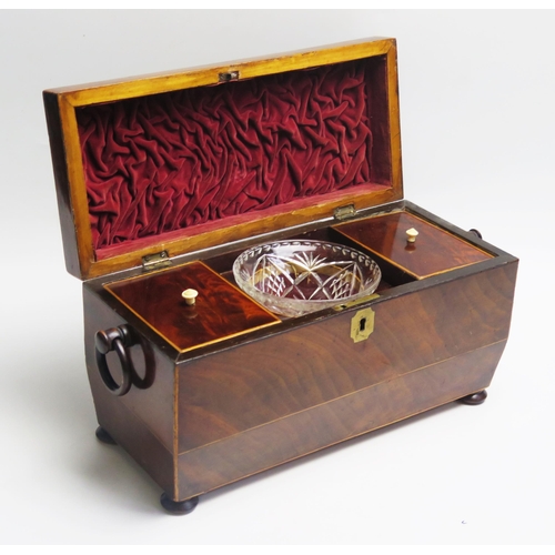 1207 - A 19th century mahogany and boxwood strung tea caddy of sarcophagus outline, the hinged lid enclosin... 