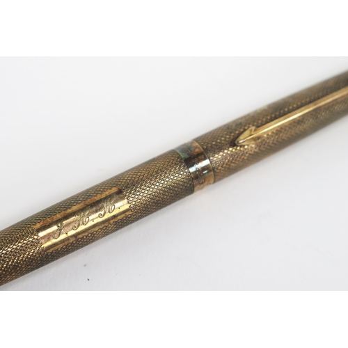 1224 - A 9ct gold Parker propelling pencil with engine turned decoration, initialled