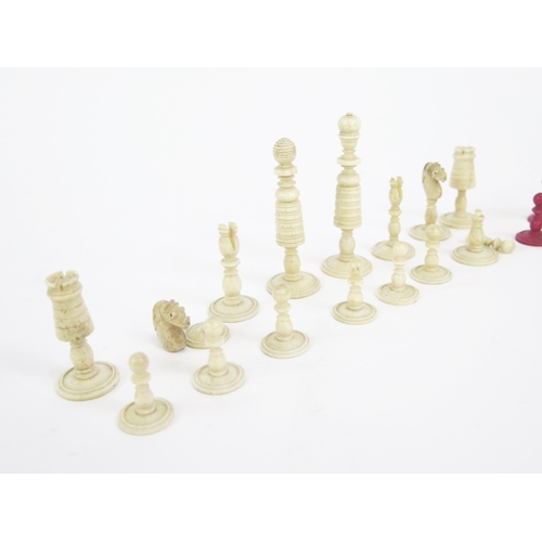 1225 - A 19th century bone chess set, one side stained red the other left natural, the king 7.5cm, the pawn... 