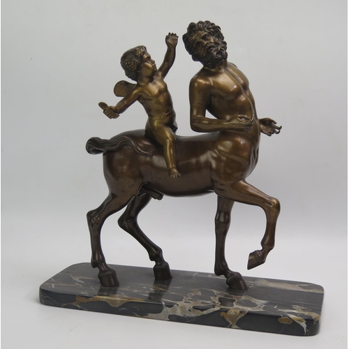 1242 - A bronze study of Chiron Centaur being teased by Eros, mounted on a rectangular polished marble base... 