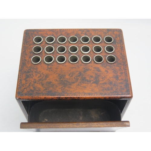 1247 - A musical cigarette box with twenty one receptacles, a operating hinged front enclosing an ashtray. ... 