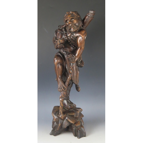 1294 - A Japanese carved root wood okimono of a bearded man with staff in one hand and turtle in the other,... 