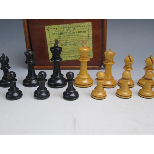 1309 - Jaques & Son Ltd, a Staunton pattern chess set, in boxwood and ebonised wood, The black king stamped... 