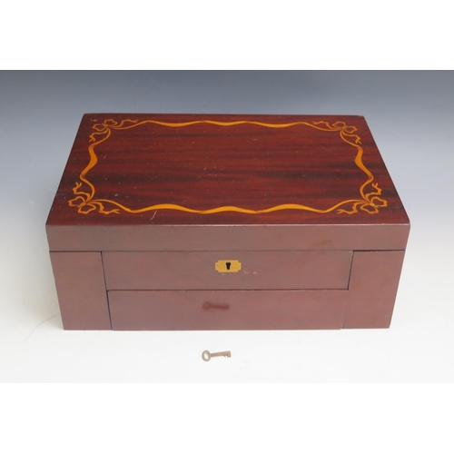 1311 - A mahogany and boxwood inlaid sewing box, the hinged lid enclosing a fitted interior of hinged compa... 