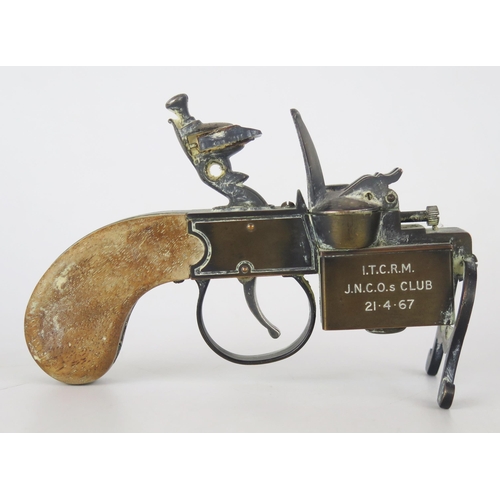 1352 - A Dunhill novelty lighter in the form of a flintlock tinderbox, presentation inscription, with bronz... 