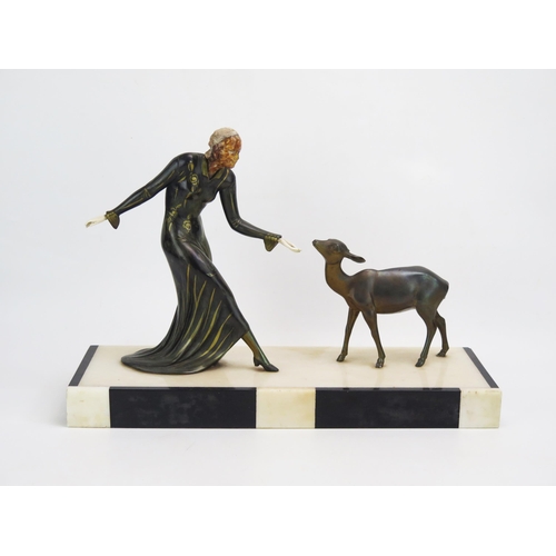 1367 - An Art Deco style figure group of young woman with a young deer, mounted on a marble base, 45cm, lon... 