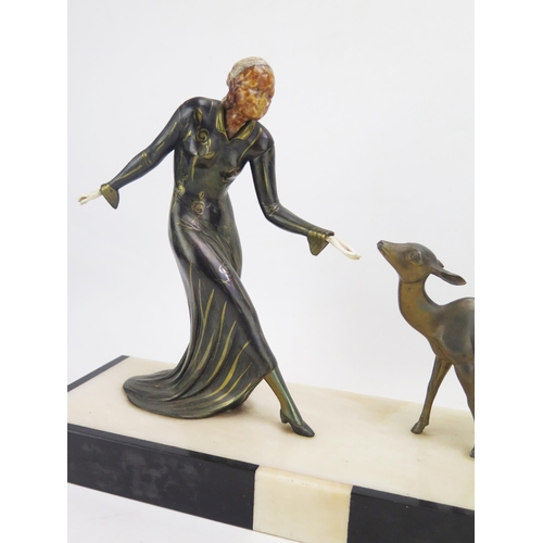 1367 - An Art Deco style figure group of young woman with a young deer, mounted on a marble base, 45cm, lon... 