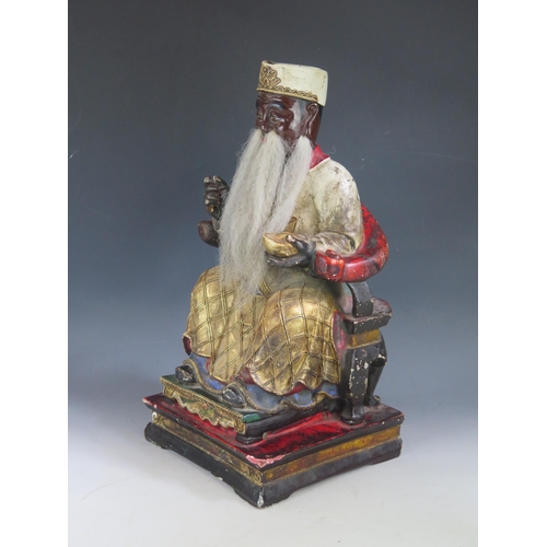 1377 - A 20th century Chinese polychrome figure of seated figure, possibly Confucius, 43cm high.