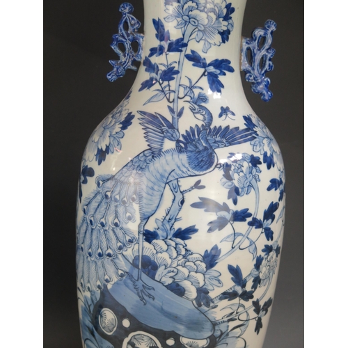 1380 - A large 20th century blue and white vase, of ovoid outline, decorated with immortals in a garden set... 