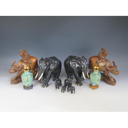 1384 - A  pair of Chinese carved wood figures of Laozi seated on a water buffalo, together with a collectio... 