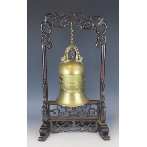 1400 - A Chinese brass temple bell, mounted on a wooden frame, overall height 47cm high.