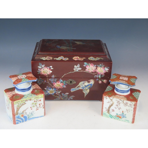 1403 - A 20th century Chinese lacquered and mother-of-pearl inlaid tea caddy, of rectangular outline contai... 