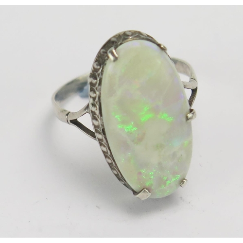 141 - A Singlet Opal and Silver Ring, 21.6x11.3mm stone. Claws damaged