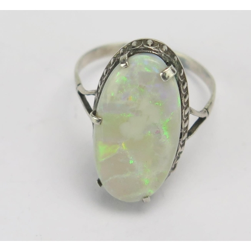 141 - A Singlet Opal and Silver Ring, 21.6x11.3mm stone. Claws damaged