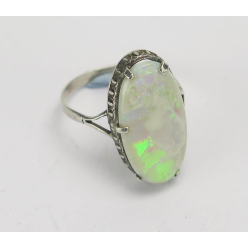 141 - A Singlet Opal and Silver Ring, 21.6x11.3mm stone. Claws damaged